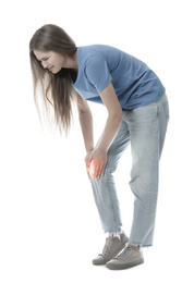 Woman suffering from knee pain on white background 