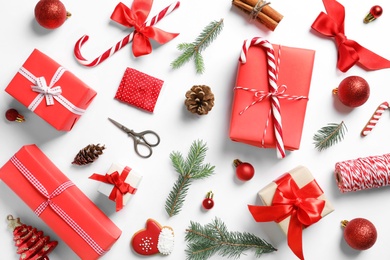 Photo of Flat lay composition with Christmas gifts on white background