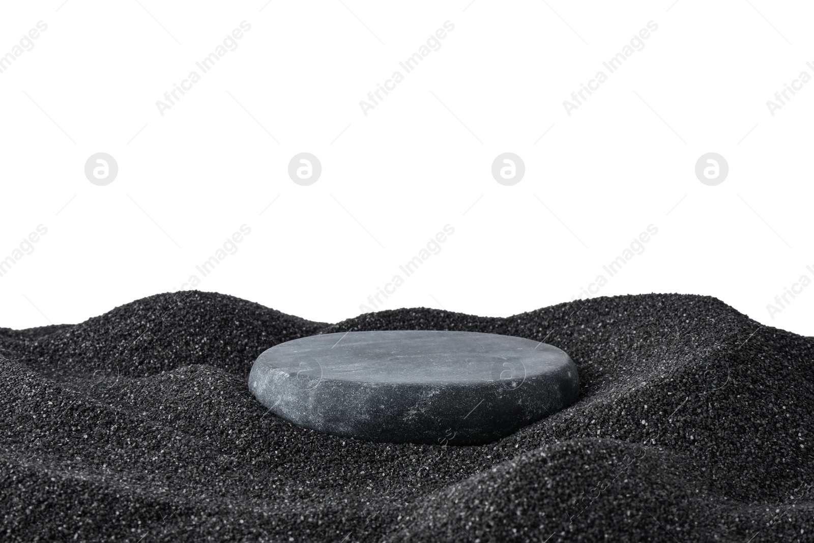 Photo of Presentation of product. Stone podium on black sand against white background