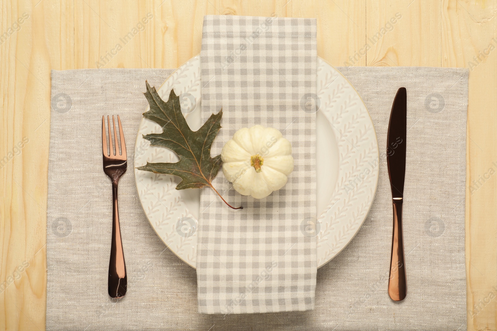 Photo of Autumn table setting, pumpkin and dry leaf, flat lay