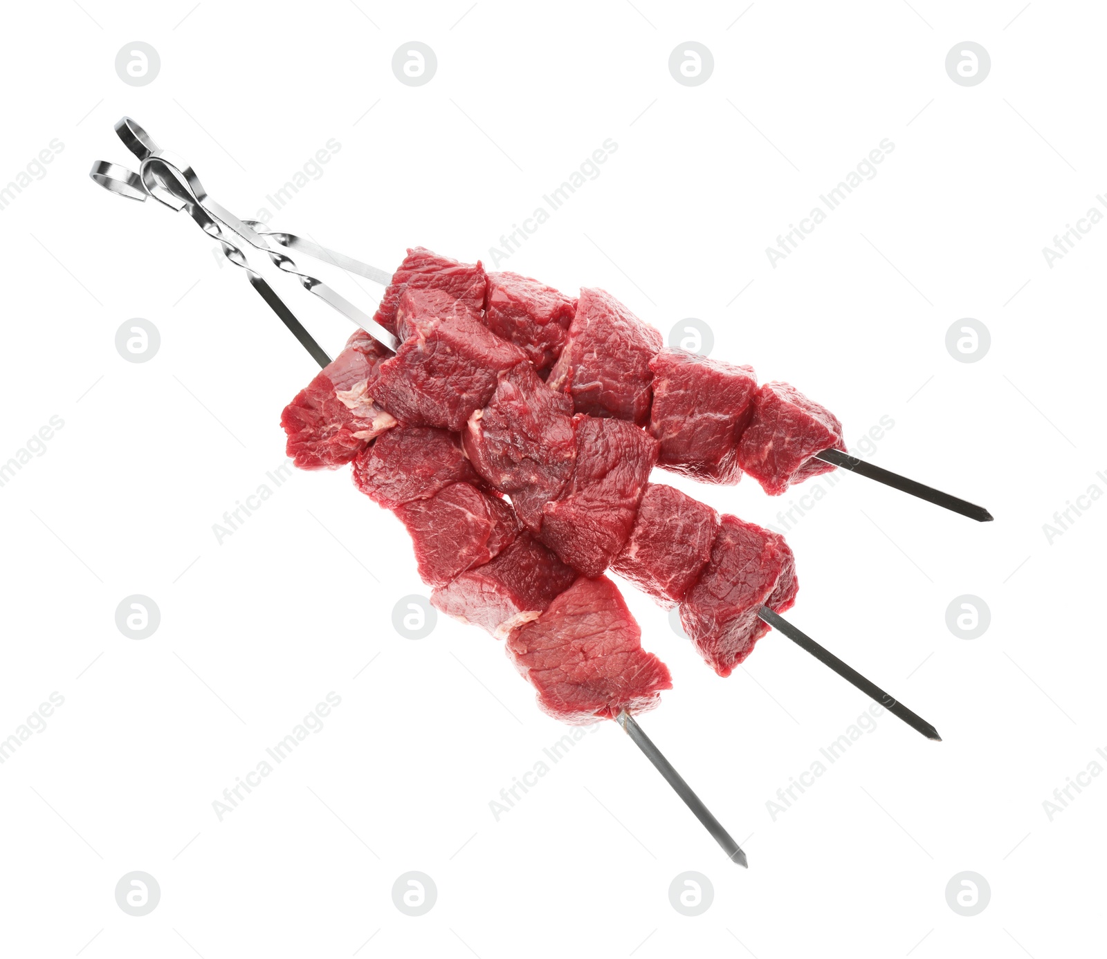 Photo of Metal skewers with raw meat on white background