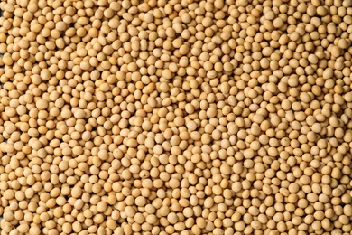 Photo of Heap of soy as background, top view