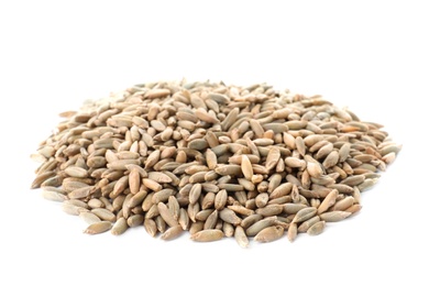 Photo of Pile of rye grains on white background. Cereal crop