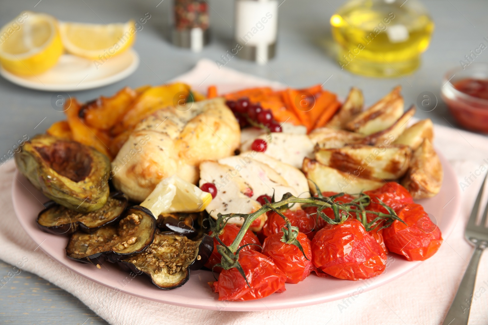Photo of Tasty cooked chicken fillet and vegetables served on table. Healthy meals from air fryer