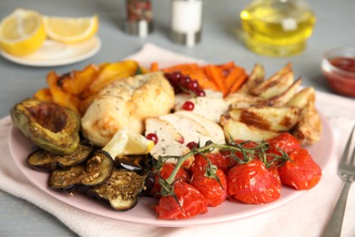Photo of Tasty cooked chicken fillet and vegetables served on table. Healthy meals from air fryer