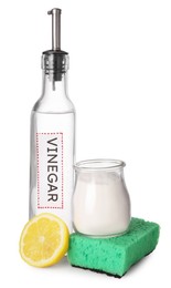 Photo of Eco friendly natural cleaners. Vinegar in bottle, cut lemon, sponge and jar of soda isolated on white