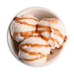 Photo of Tasty ice cream with caramel sauce in bowl on white background