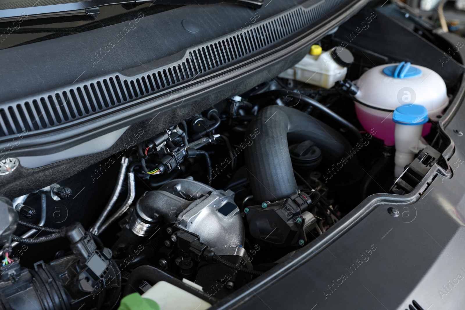 Photo of Closeup view of engine bay in modern auto