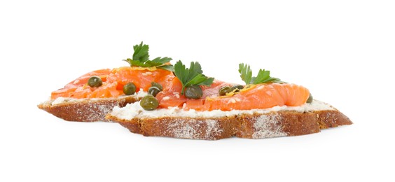 Photo of Tasty canapes with salmon, capers and cream cheese isolated on white