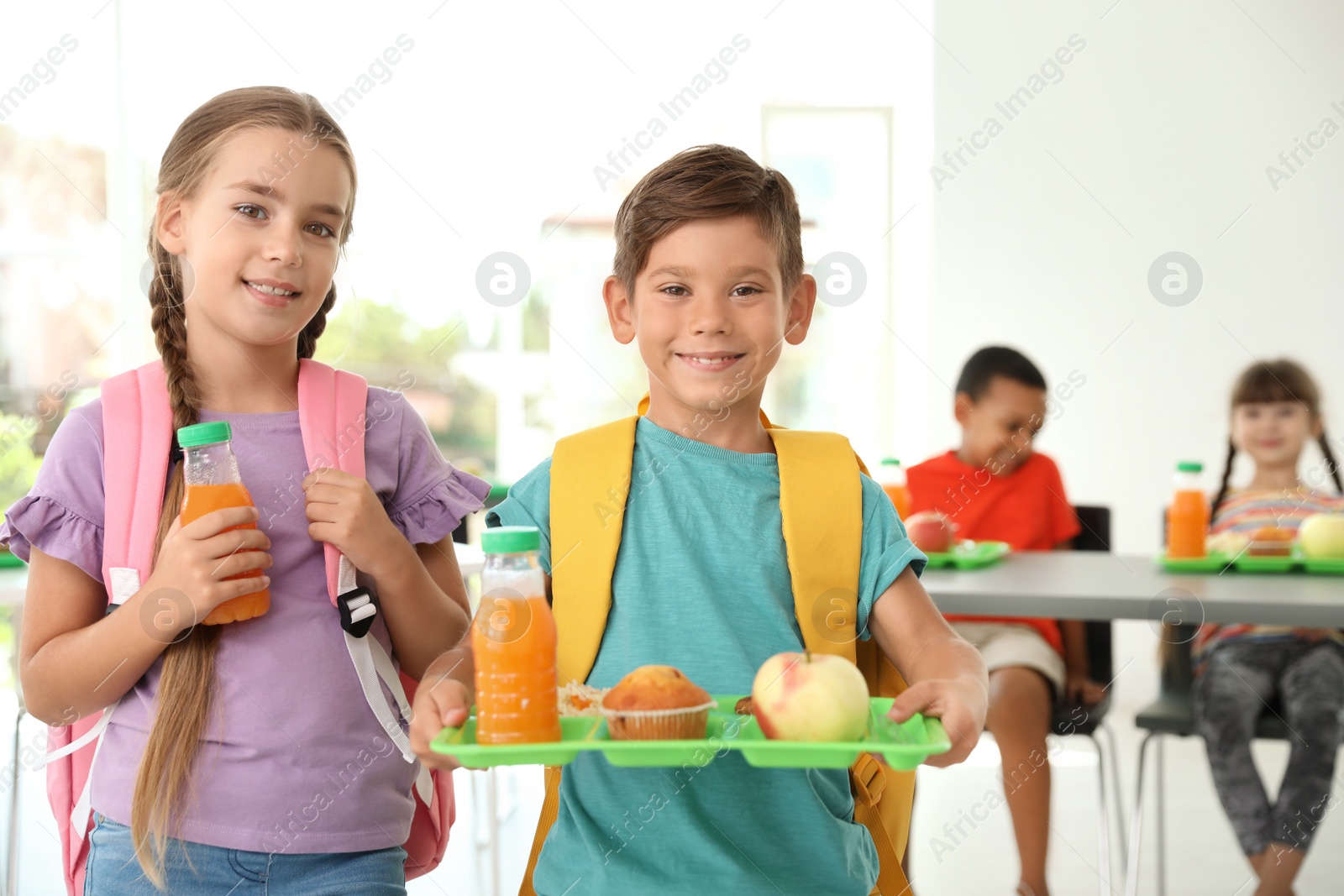 Photo of Children with healthy food at school canteen