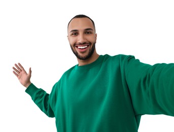 Photo of Smiling young man taking selfie on white background