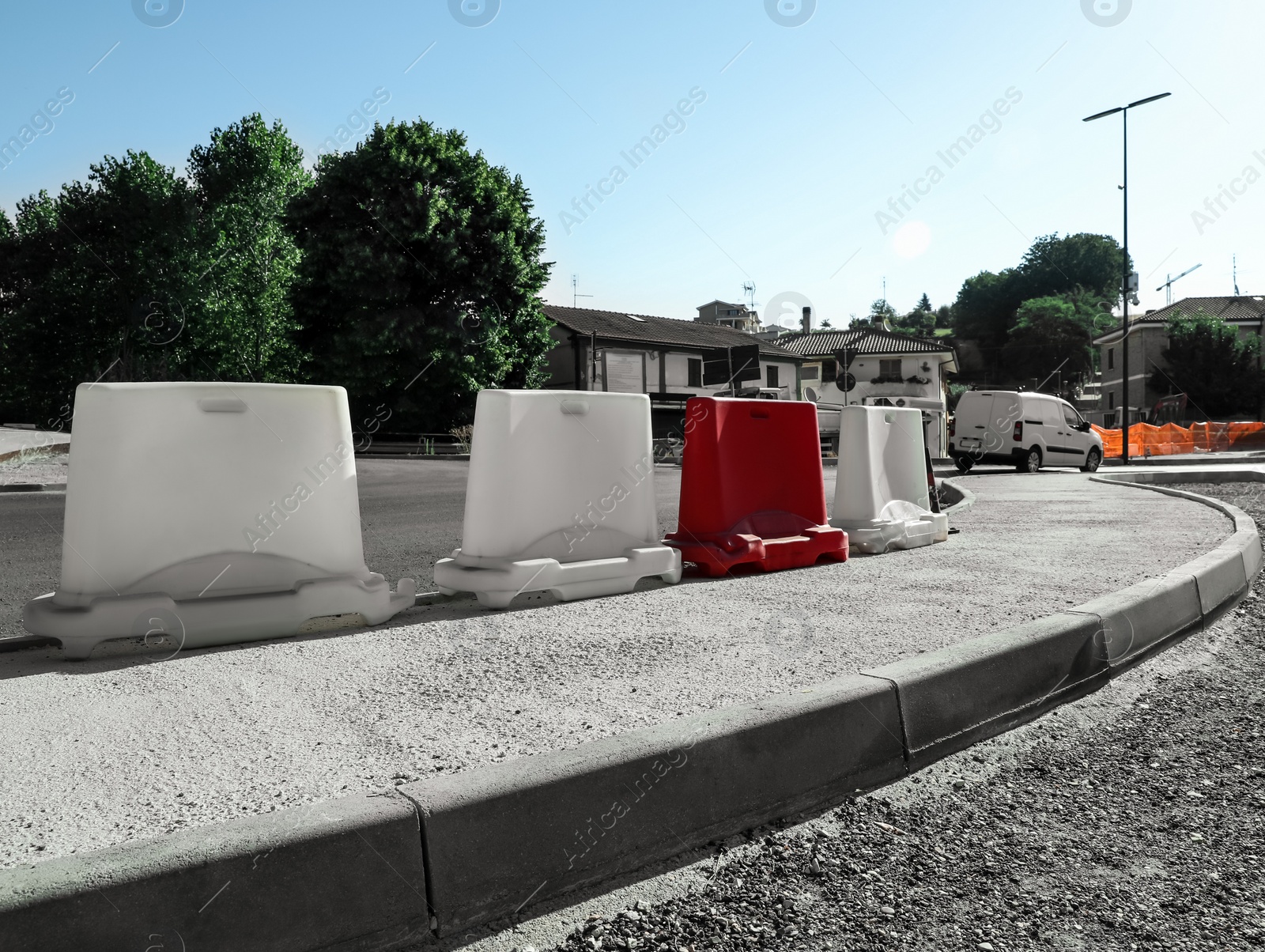 Photo of Road with plastic safety barriers on city street