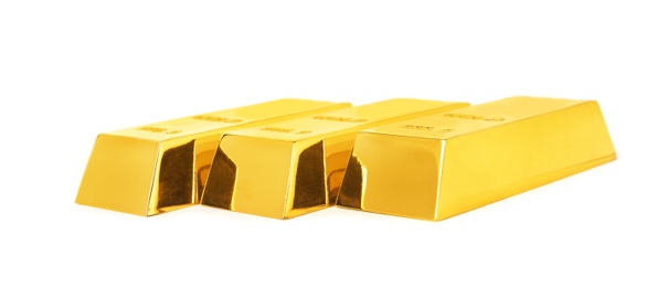 Photo of Precious shiny gold bars on white background