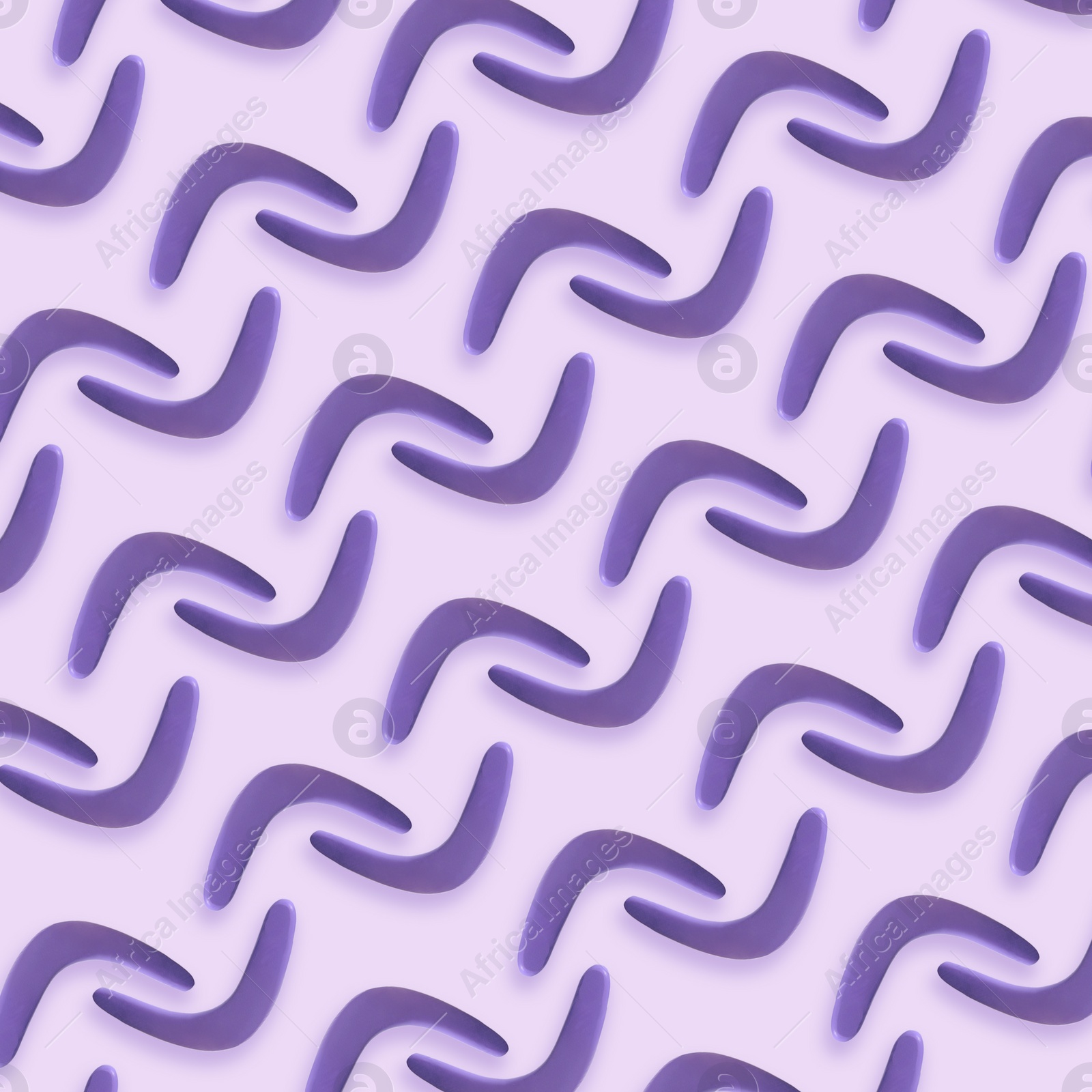 Image of Violet boomerangs on light background, flat lay