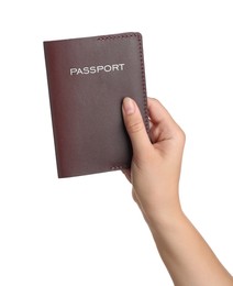 Photo of Woman holding passport in brown leather case on white background, closeup