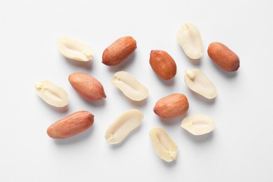 Fresh peanuts on white background, flat lay