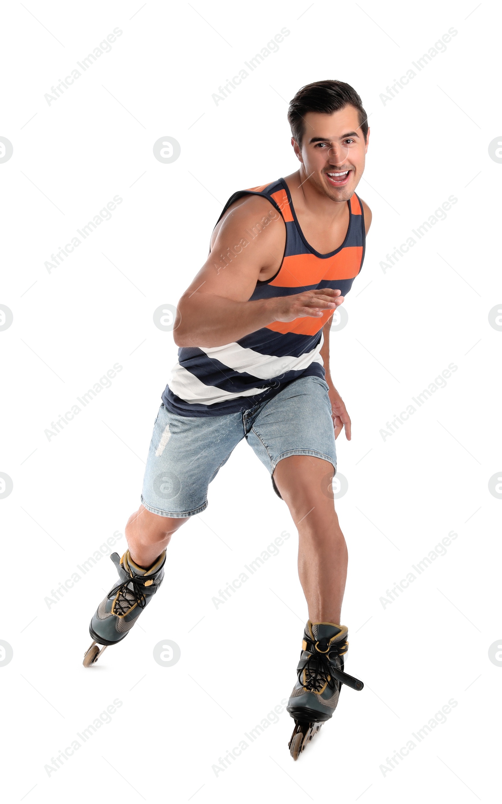 Photo of Handsome young man with inline roller skates on white background