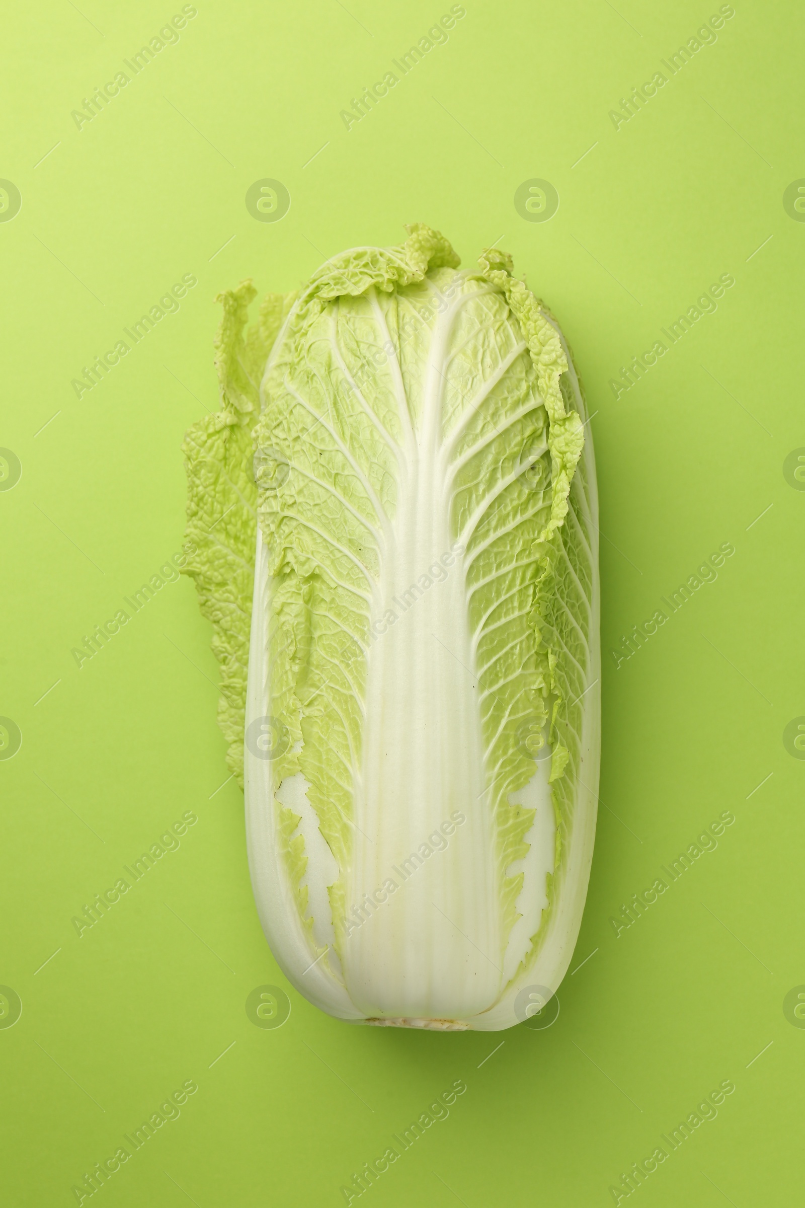 Photo of Fresh ripe Chinese cabbage on light green background, top view