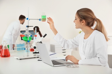 Photo of Medical student working in modern scientific laboratory