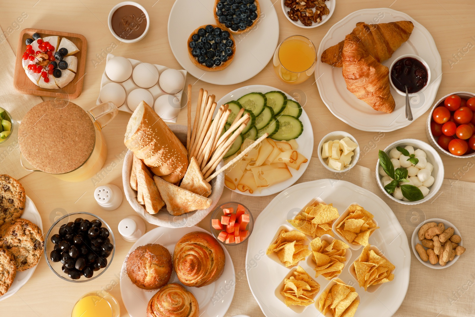 Photo of Dishes with different food on table, flat lay. Luxury brunch