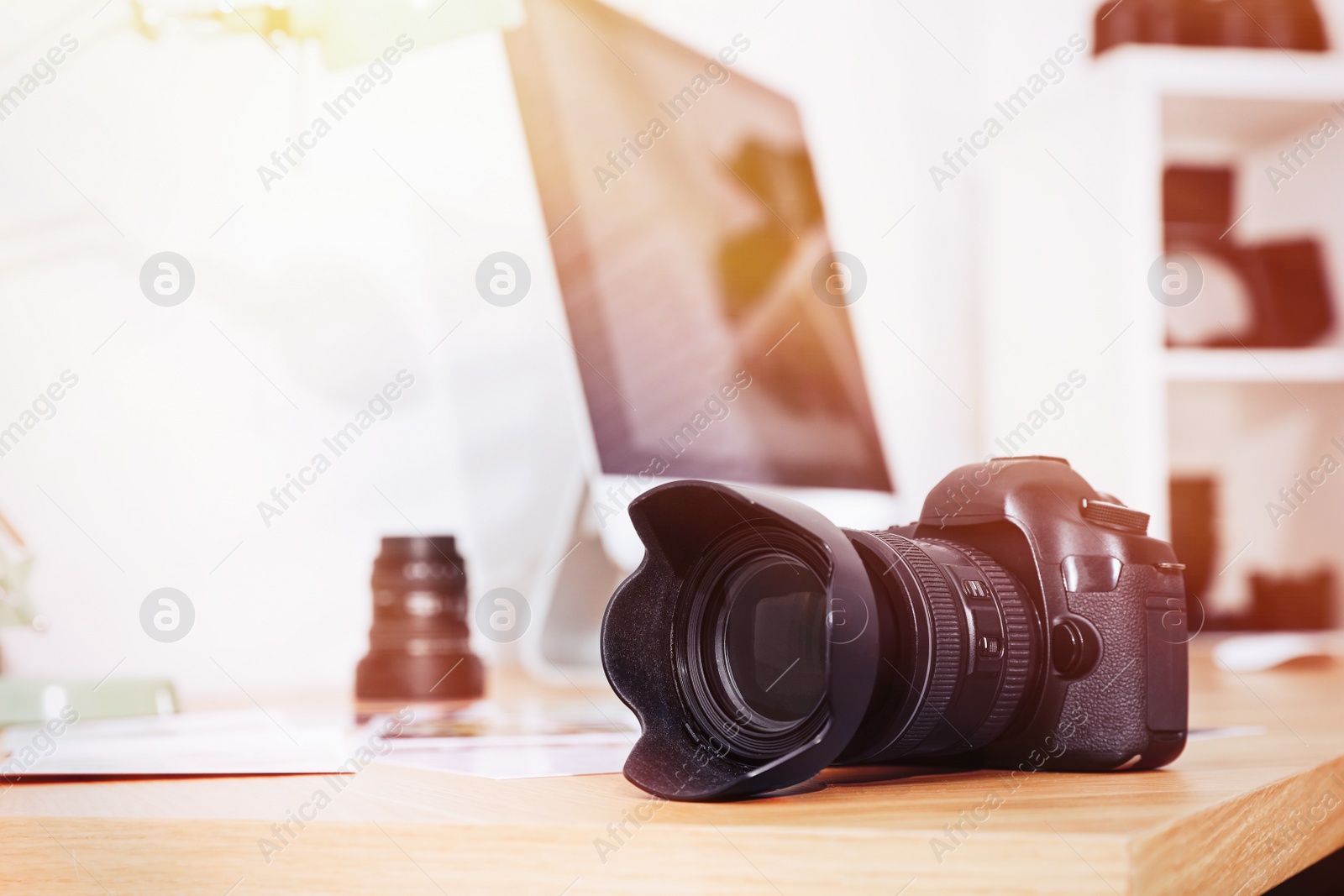 Image of Photographer's workplace with professional camera in office