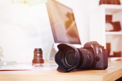 Image of Photographer's workplace with professional camera in office