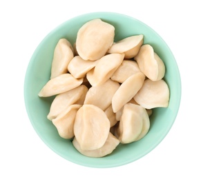 Delicious cooked dumplings in bowl on white background, top view