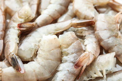 Photo of Fresh raw shrimps as background, closeup view