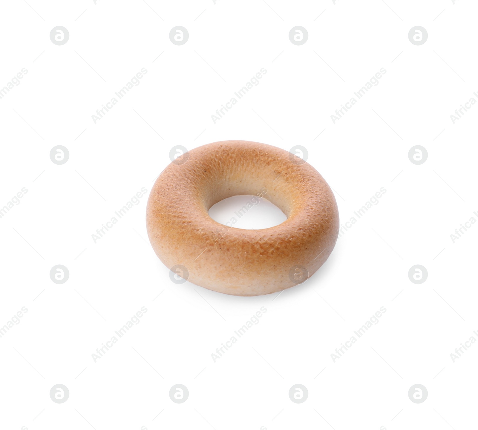 Photo of One tasty dry bagel (sushka) isolated on white