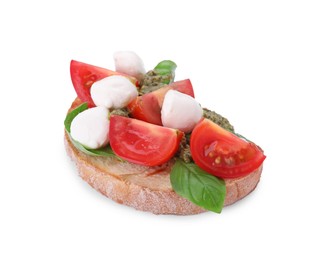 Photo of Delicious Caprese sandwich with mozzarella, tomatoes, basil and pesto sauce isolated on white