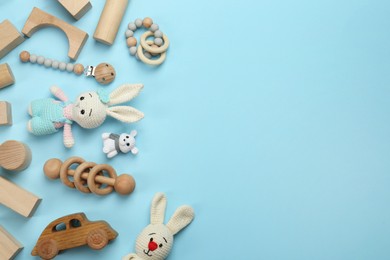 Different children's toys on light blue background, flat lay. Space for text