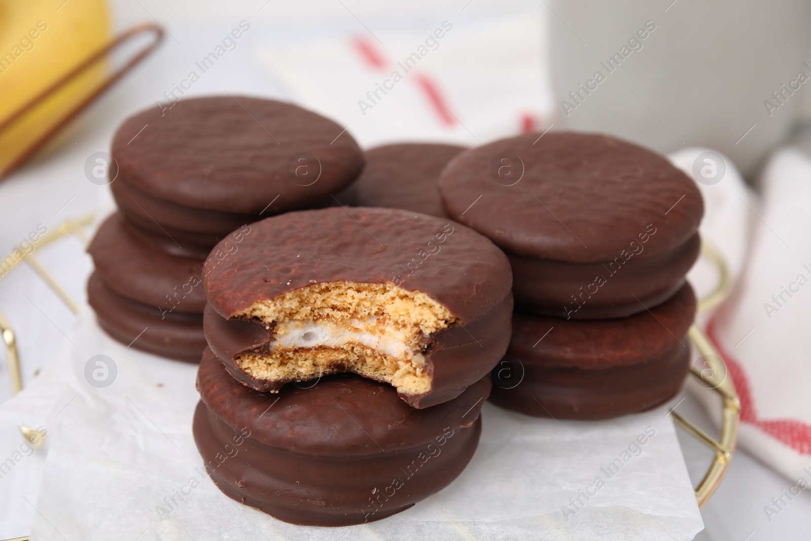 Photo of Tasty banana choco pies on stand, closeup