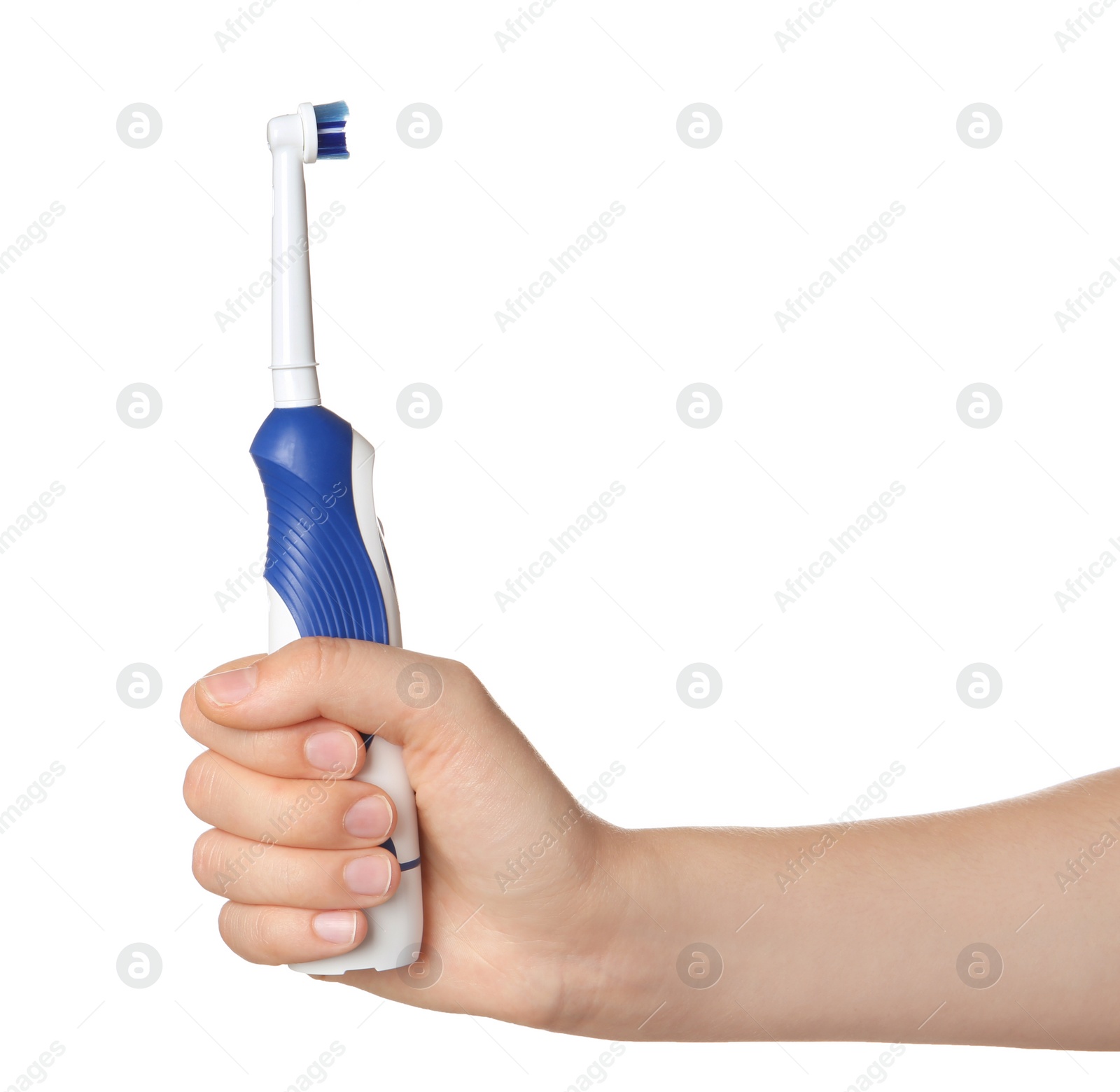 Photo of Woman holding electric toothbrush against white background