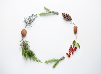 Photo of Flat lay composition with Christmas tree branches on white background. Space for text