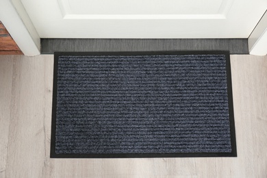 Photo of New clean mat near entrance door, top view