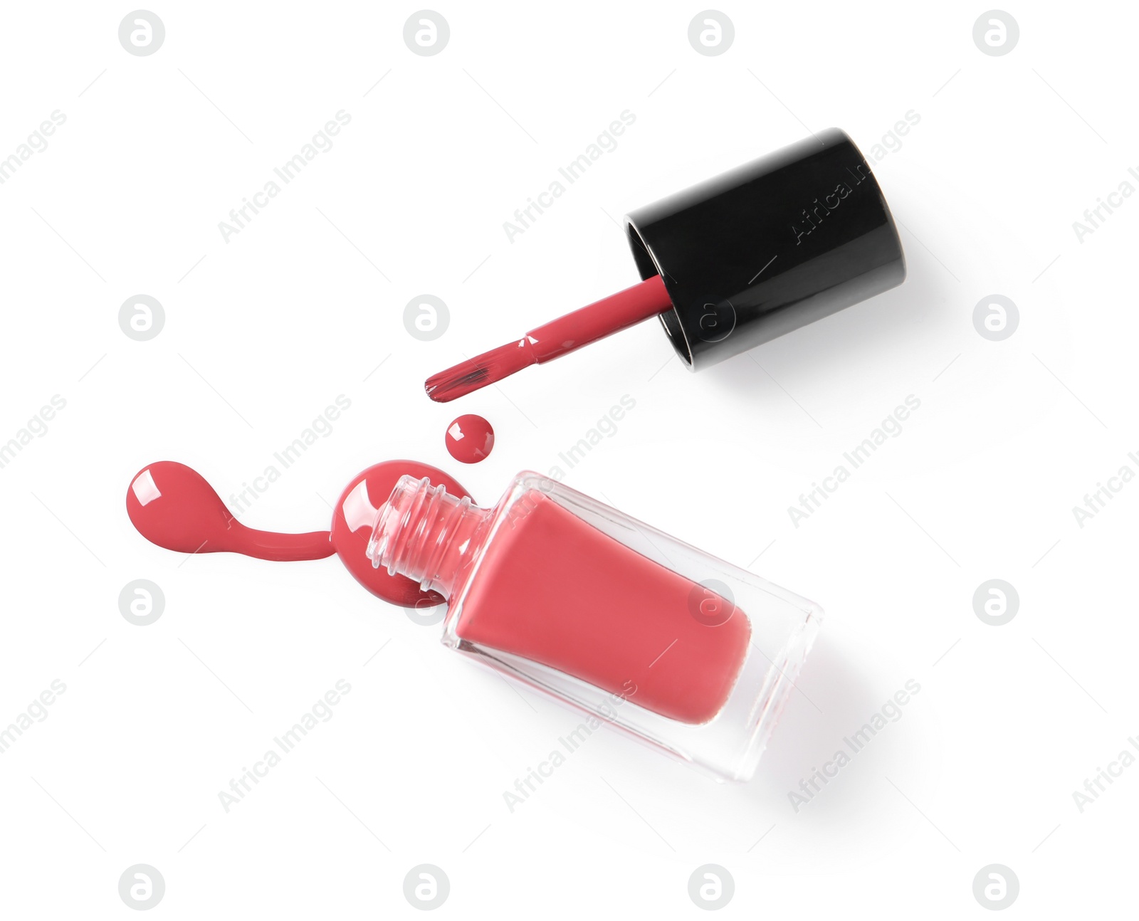 Photo of Spilled color nail polish with bottle and brush on white background, top view