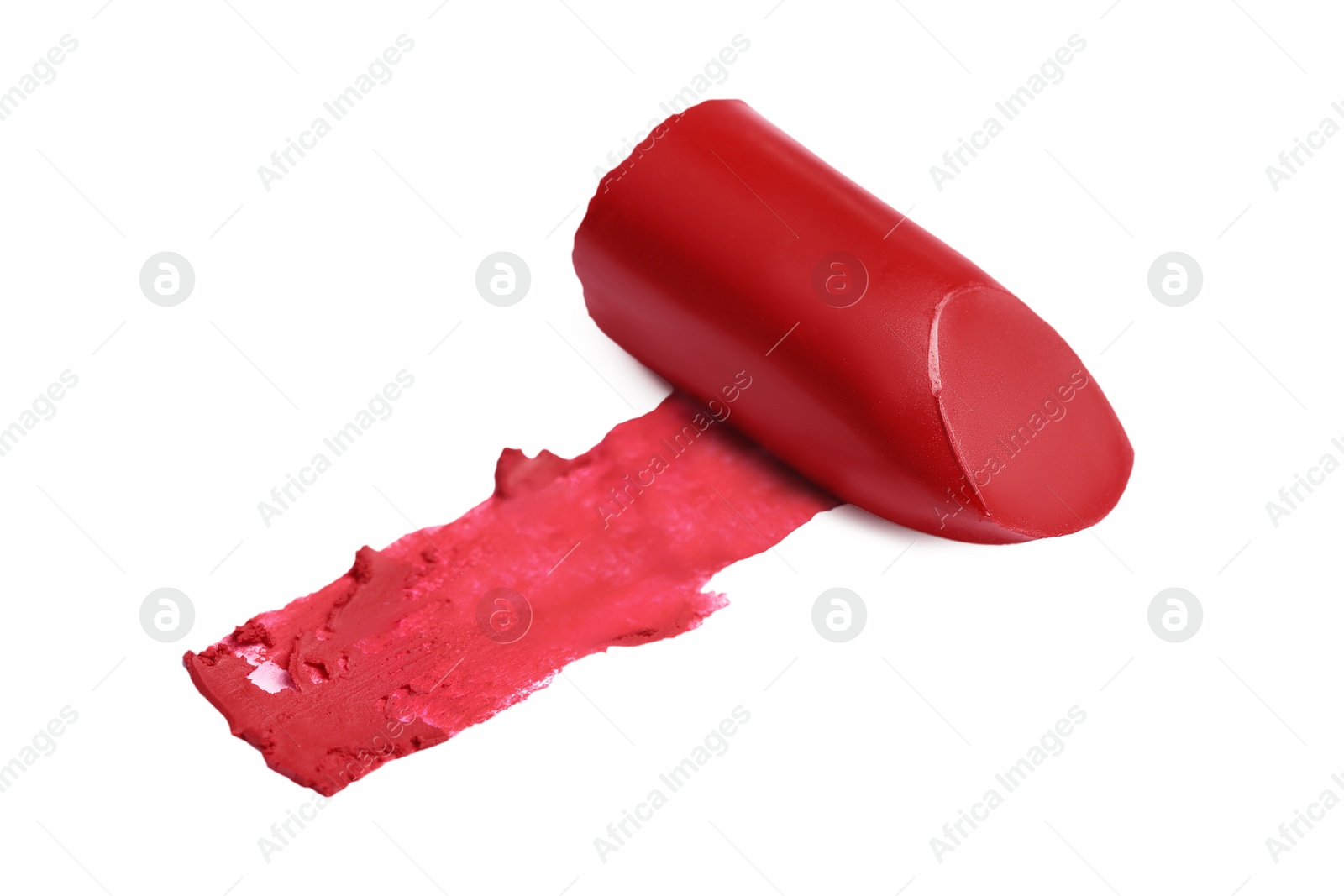 Photo of Red lipstick and smear isolated on white