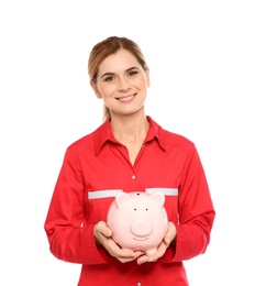 Portrait of female emergency doctor with piggy bank on white background