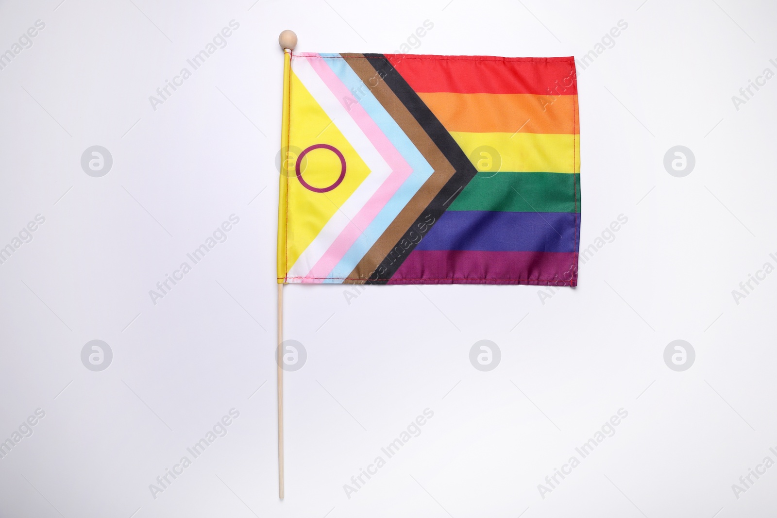 Photo of Bright progress flag on white background. LGBT pride