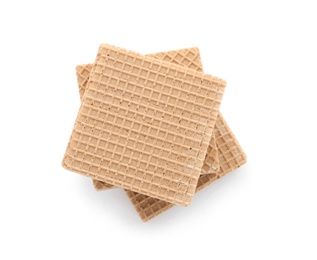 Delicious crispy wafers on white background, top view. Sweet food