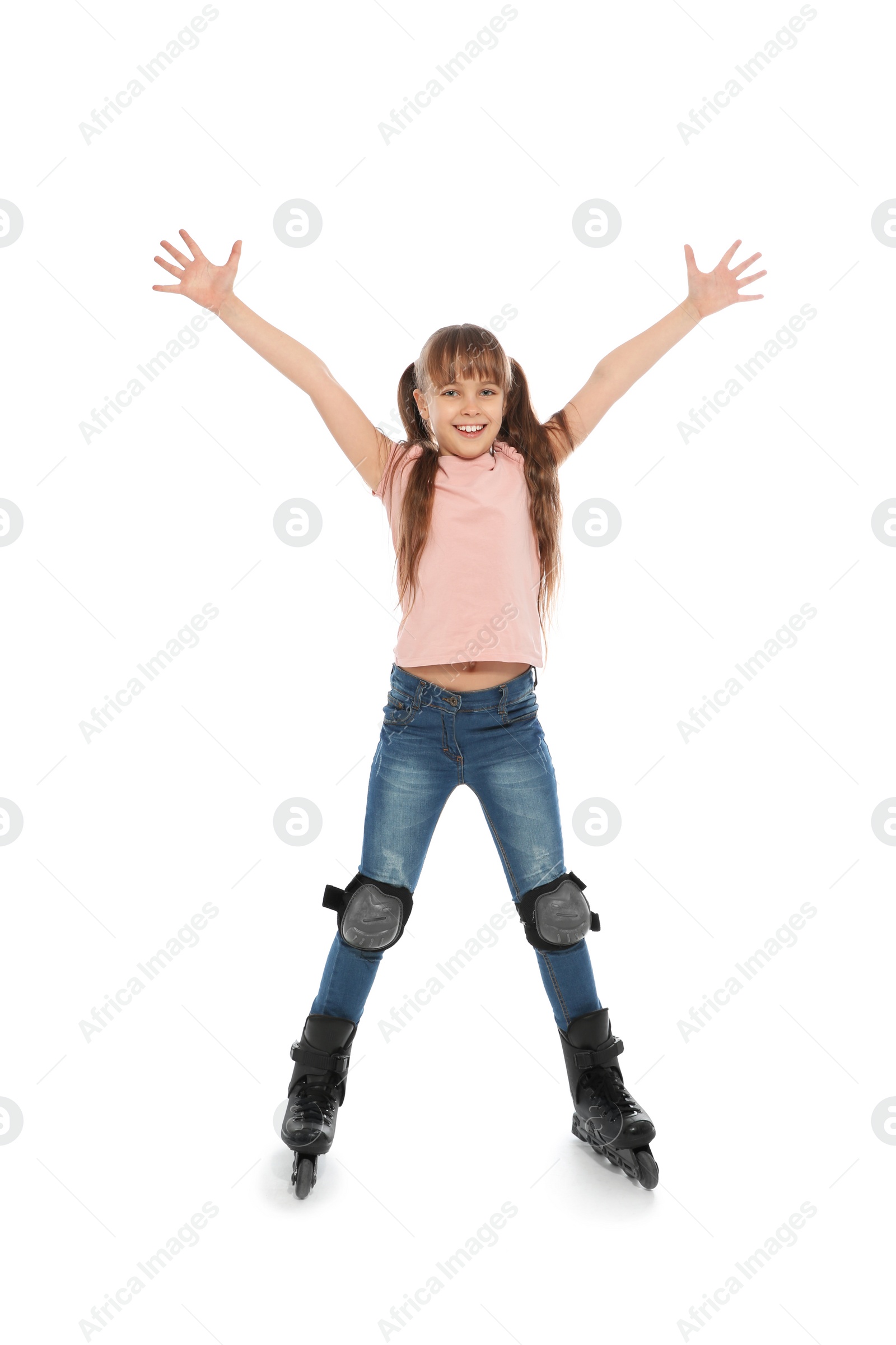 Photo of Little girl with inline roller skates on white background