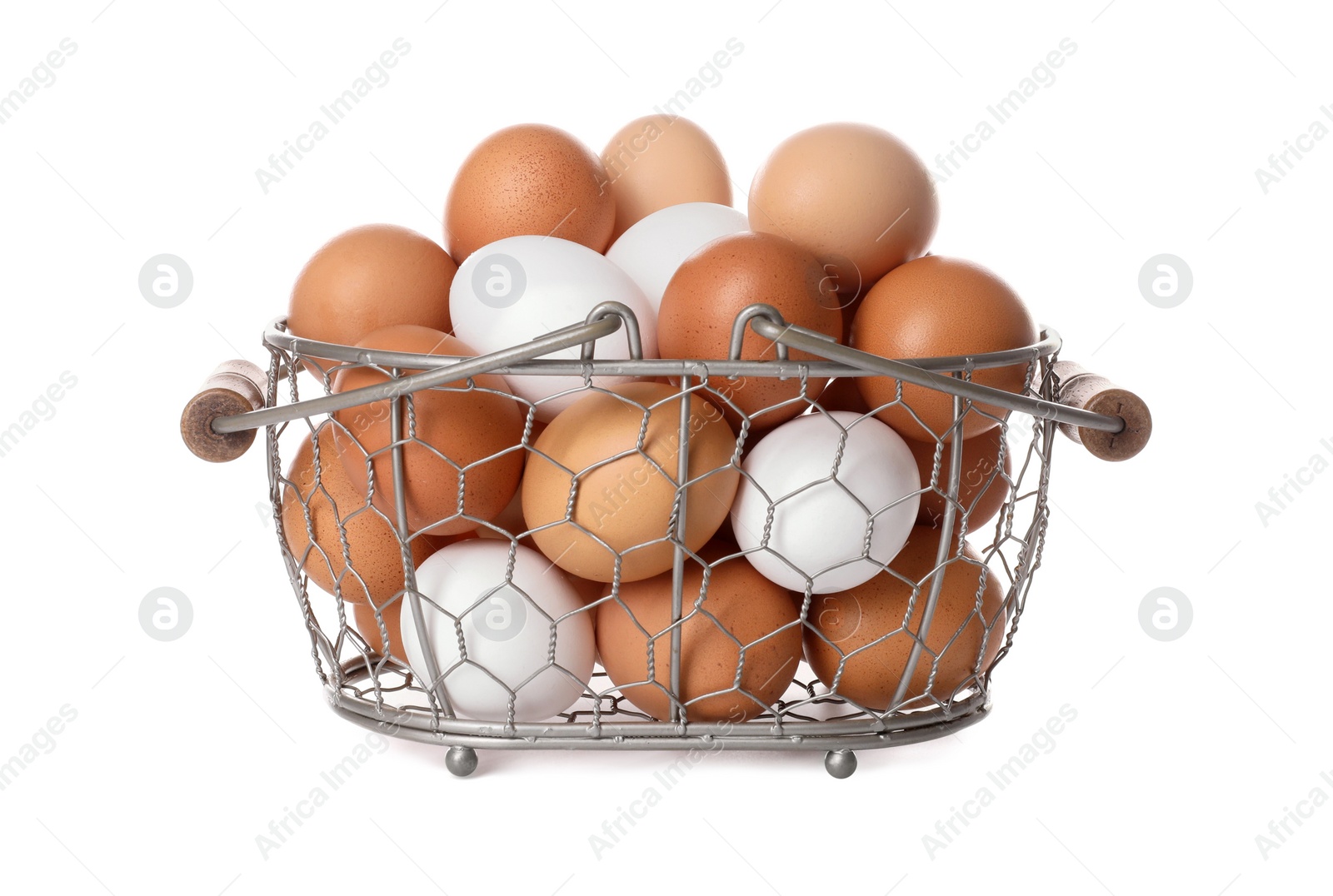 Photo of Fresh chicken eggs in metal basket isolated on white