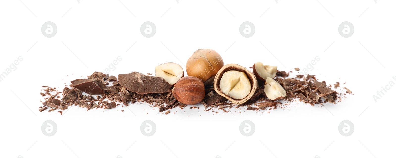 Photo of Delicious chocolate crumbles and hazelnuts on white background