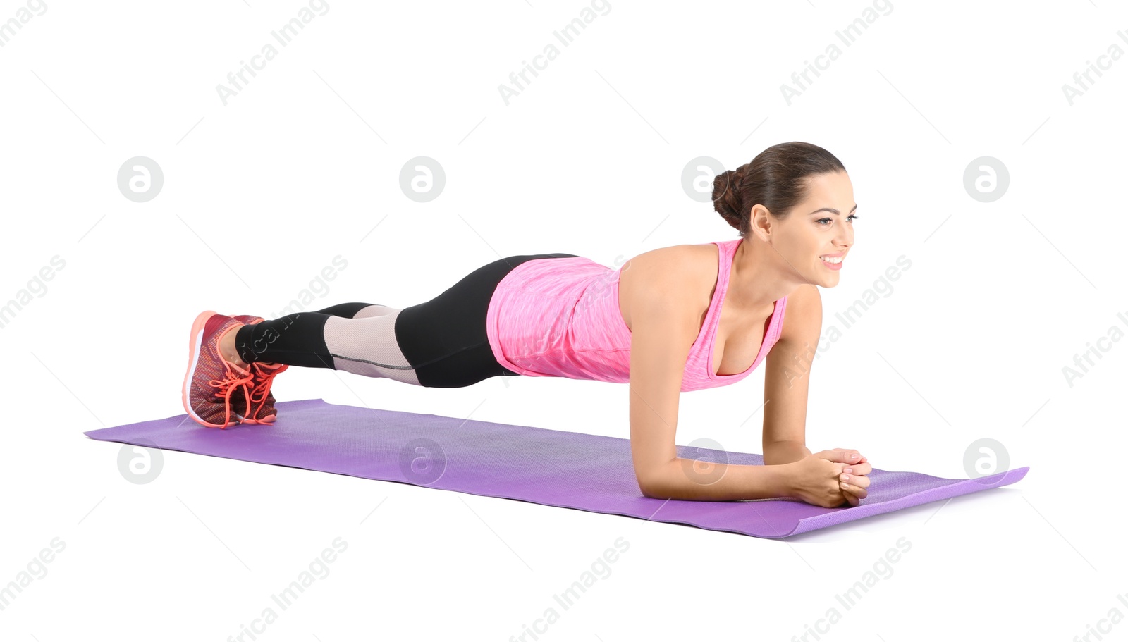 Photo of Young beautiful woman doing exercise on white background. Home fitness