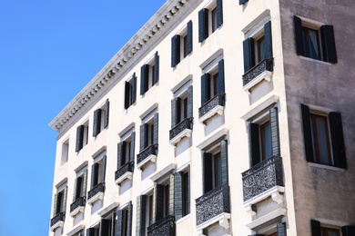 Photo of View of beautiful old building with windows