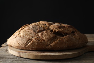 Freshly baked sourdough bread on wooden table