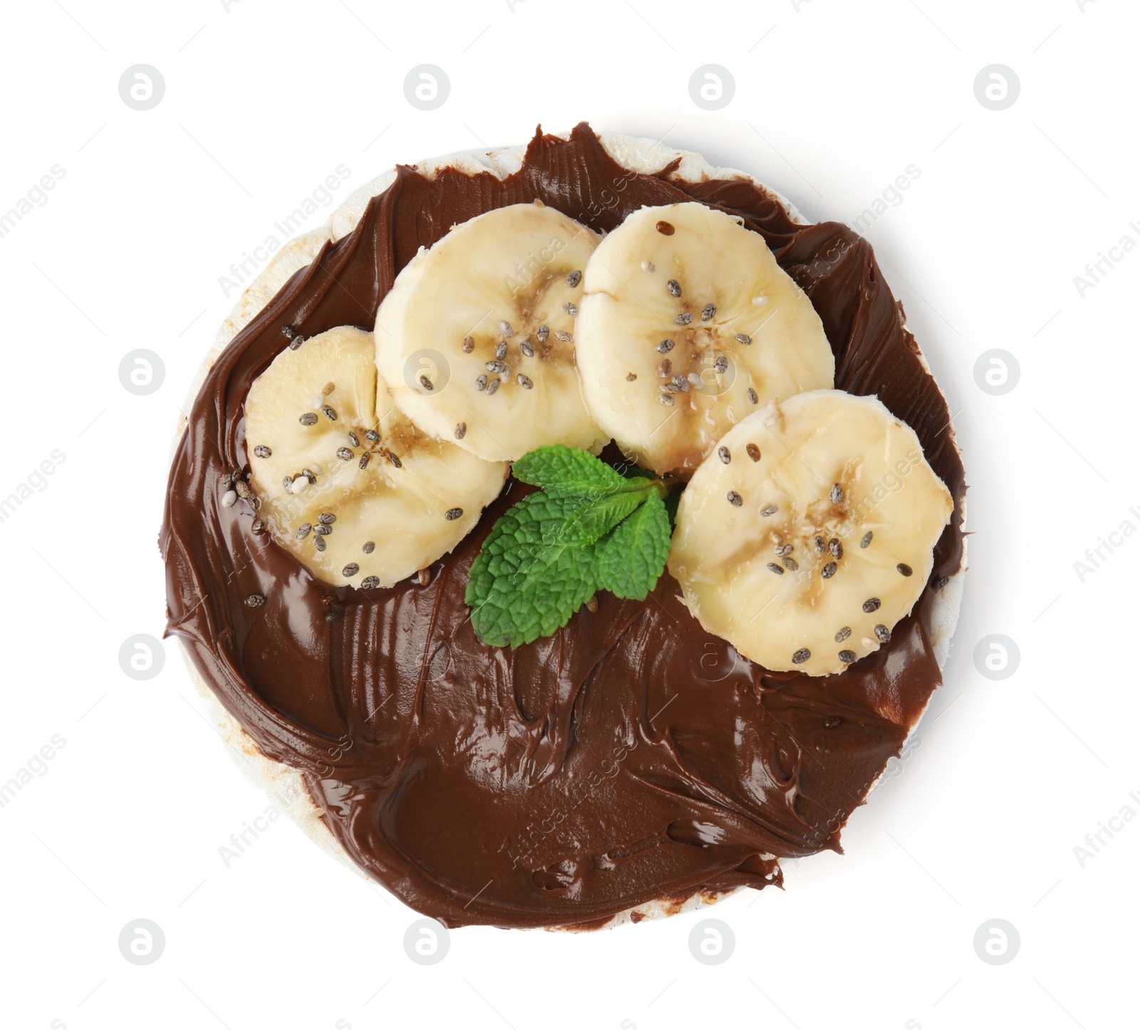 Photo of Puffed rice cake with chocolate spread, banana and mint isolated on white, top view