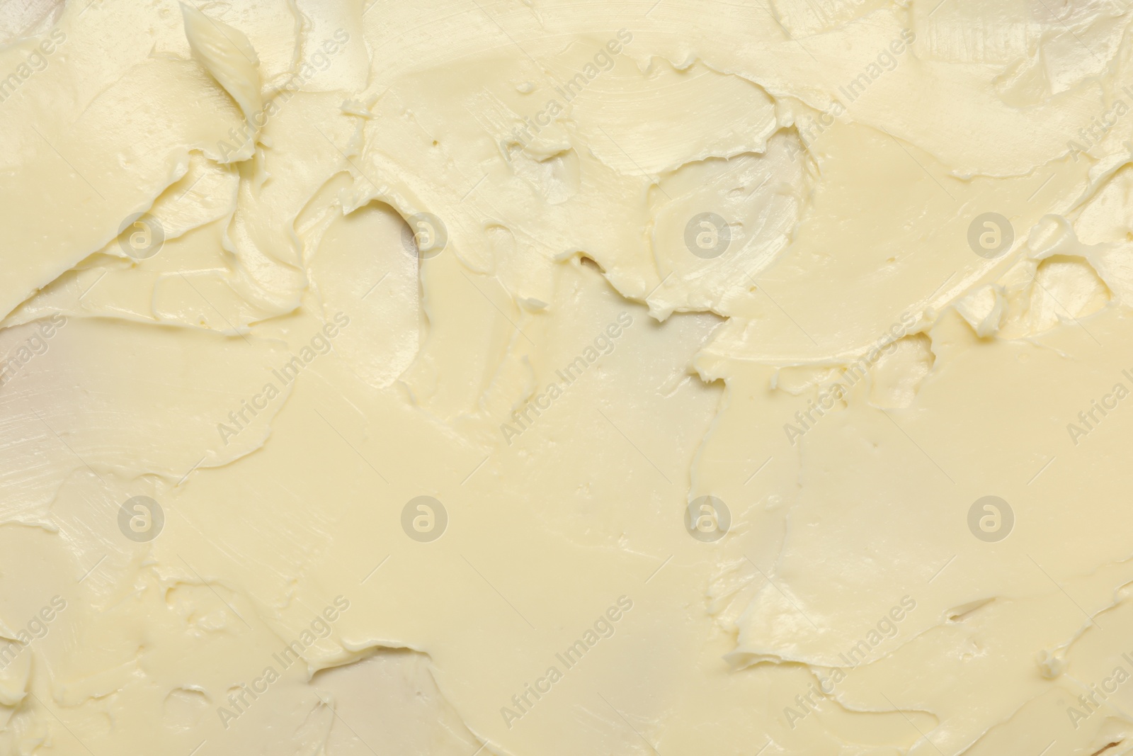 Photo of Texture of fresh natural butter as background, top view