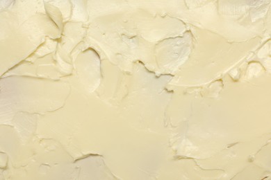 Photo of Texture of fresh natural butter as background, top view