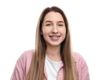 Portrait of smiling woman with dental braces on white background